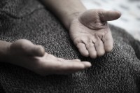 Hands of senior Muslim man praying